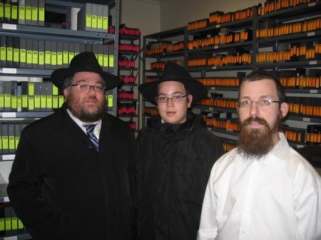 The two Shluchim and JEM director Elkanah in the JEM archive.